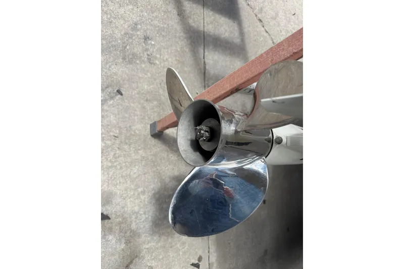 Slide: The Image of Close-up of a 2017 Pro-Line 26 Super Sport boat propeller on concrete surface. - 30