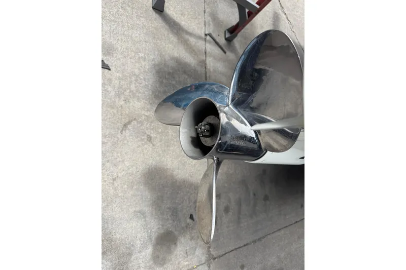 Slide: The Image of Close-up of a 2017 Pro-Line 26 Super Sport boat propeller on concrete surface. - 31