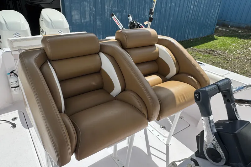 Slide: The Image of Luxurious brown leather seats on a 2017 Pro-Line 26 Super Sport boat. - 6