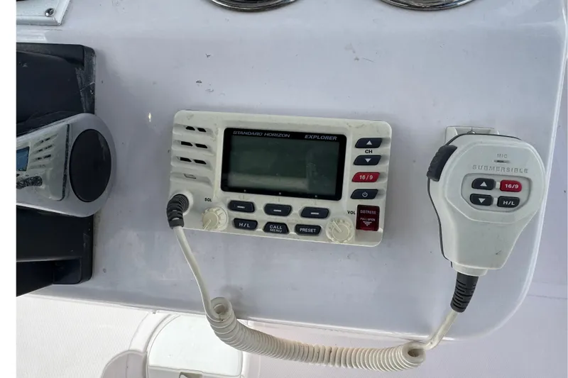 Slide: The Image of Control panel of a 2017 Pro-Line 26 Super Sport boat with radio equipment. - 8