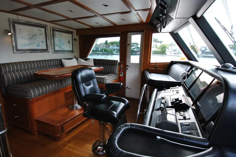 Slide: The Image of Interior of 2002 Grand Alaskan Cockpit Motor Yacht with helm and seating area. - 22