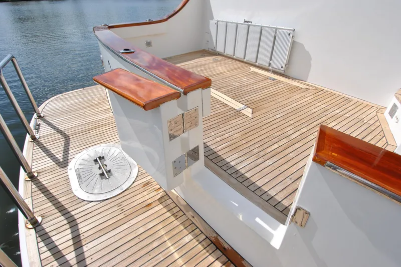 Slide: The Image of 2002 Grand Alaskan Cockpit Motor Yacht with teak deck and polished wood accents. - 3