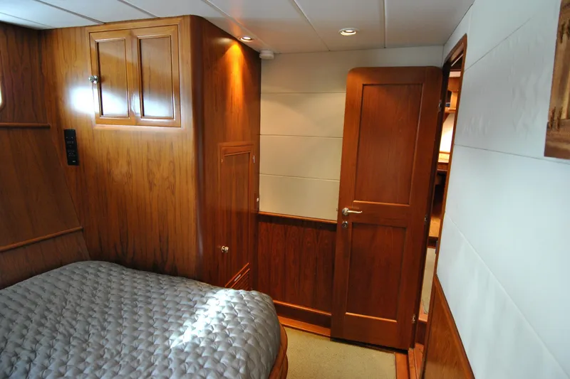Slide: The Image of Luxurious wooden interior of 2002 Grand Alaskan Cockpit Motor Yacht cabin. - 30