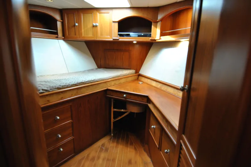 Slide: The Image of Luxurious wooden cabin interior of 2002 Grand Alaskan Cockpit Motor Yacht with bed and desk. - 33