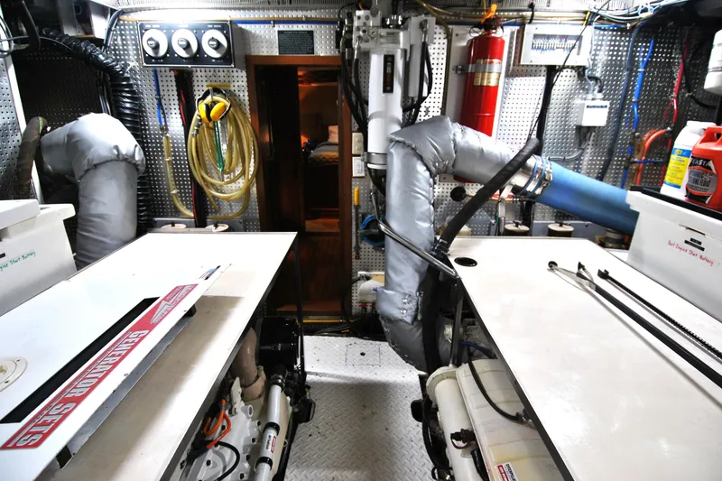 Slide: The Image of Engine room of 2002 Grand Alaskan Cockpit Motor Yacht with equipment and wiring. - 35