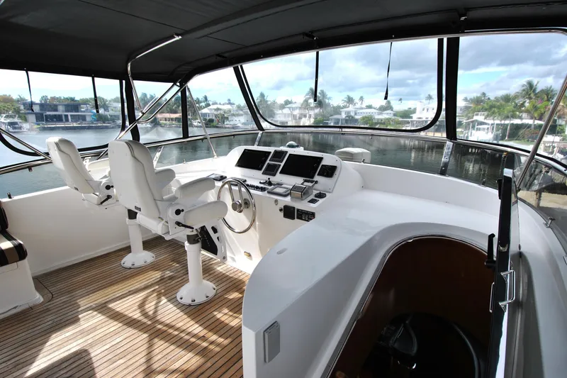 Slide: The Image of 2002 Grand Alaskan Cockpit Motor Yacht helm with modern controls and panoramic views. - 39