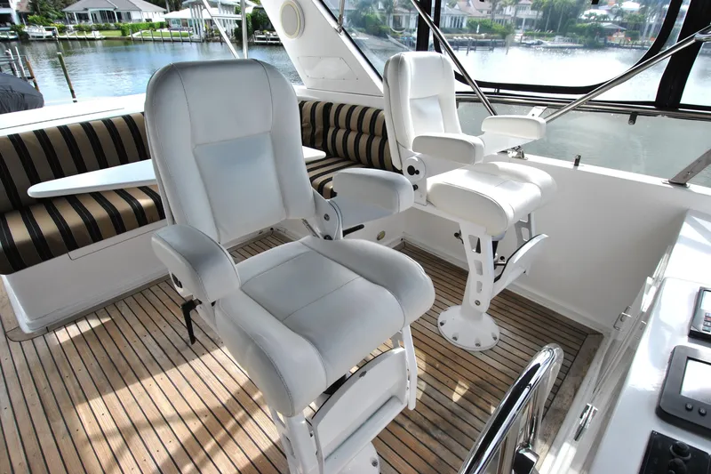 Slide: The Image of Luxurious cockpit of 2002 Grand Alaskan Motor Yacht with plush seating and scenic water views. - 41