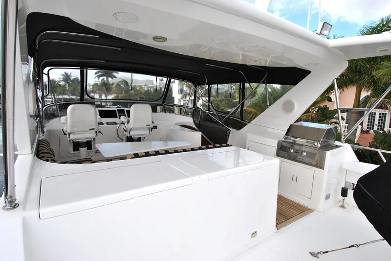 Slide: The Image of 2002 Grand Alaskan Cockpit Motor Yacht with seating and grill on deck. - 45