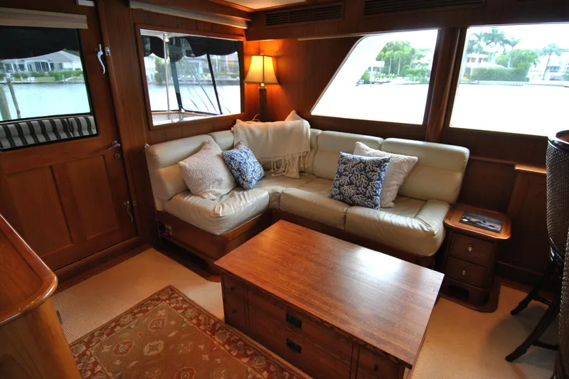 Slide: The Image of Luxurious interior of 2002 Grand Alaskan Cockpit Motor Yacht with cozy seating and elegant decor. - 9