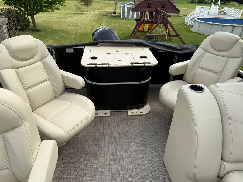 Slide: The Image of Interior of a 2017 Sylvan 822 Mirage Party Fish boat with beige seats. - 4