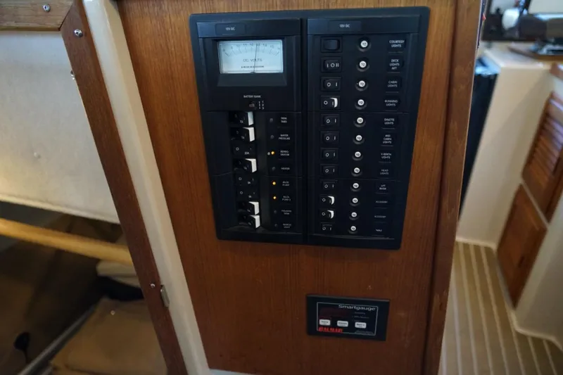 Slide: The Image of Electrical panel on 2014 Ranger Tugs R-31 boat, featuring switches and gauges. - 20