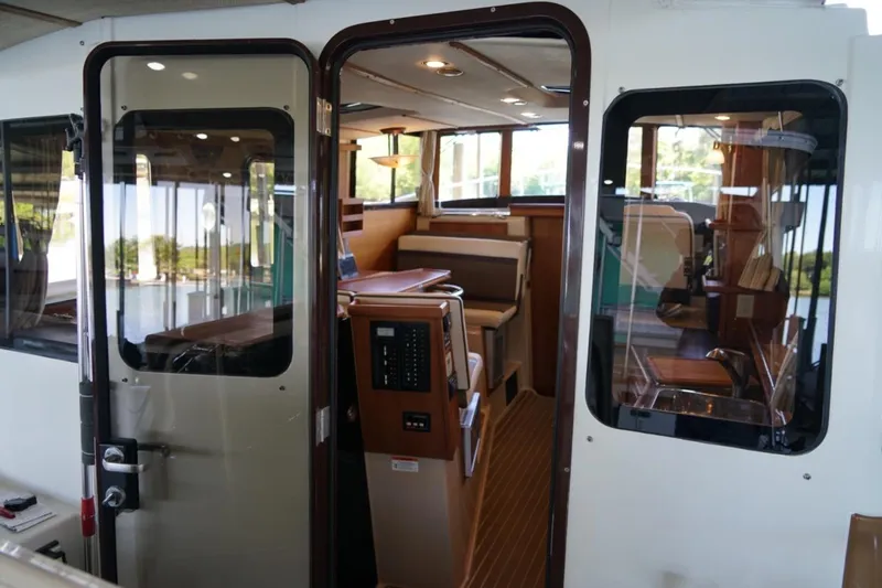 Slide: The Image of Interior view of 2014 Ranger Tugs R-31 boat, showcasing cabin and seating area. - 26