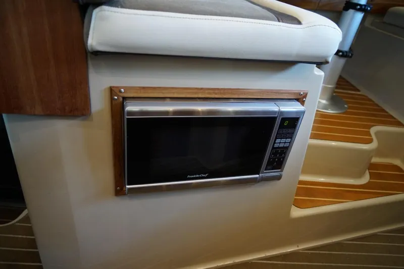 Slide: The Image of Built-in microwave in 2014 Ranger Tugs R-31 boat interior. - 30