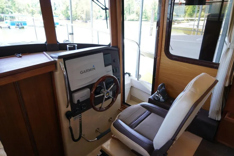 Slide: The Image of Interior helm of 2014 Ranger Tugs R-31 with Garmin navigation system. - 39