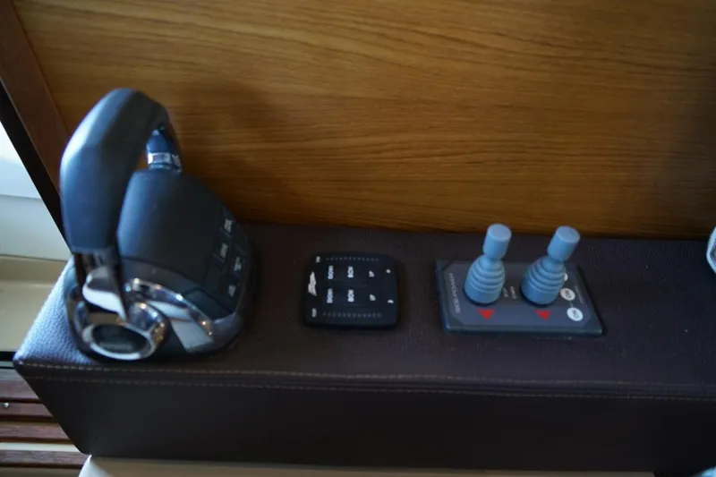 Slide: The Image of 2014 Ranger Tugs R-31 boat controls with throttle and joystick interface. - 41