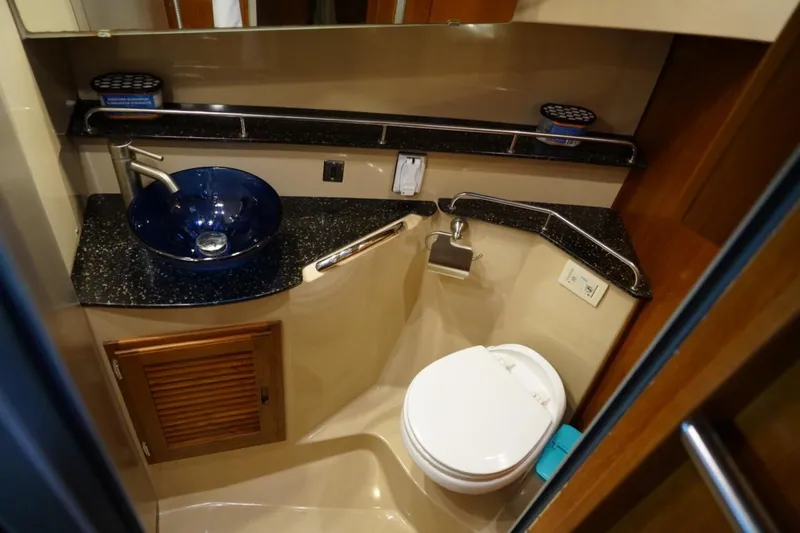 Slide: The Image of 2014 Ranger Tugs R-31 bathroom with modern sink and toilet. - 43