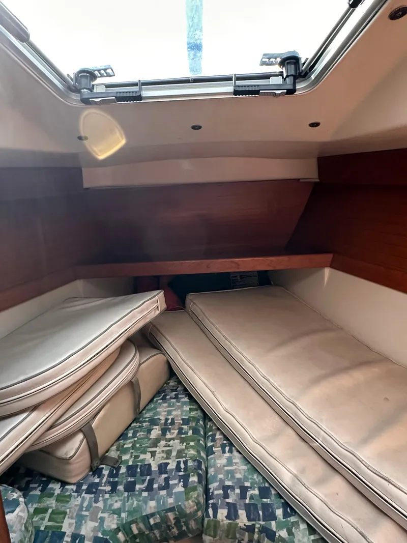 Slide: The Image of Interior cabin of 2000 Catalina 320 sailboat with cushions and bedding. - 11
