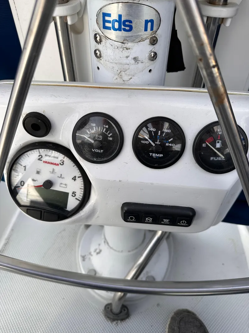 Slide: The Image of Control panel of a 2000 Catalina 320 sailboat with gauges and Edson steering. - 6