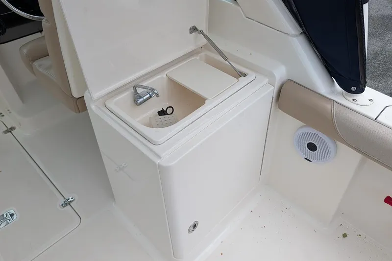 Slide: The Image of 2011 Pursuit DC 265 Dual Console boat sink and faucet detail. - 13
