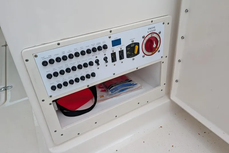 Slide: The Image of Control panel of a 2011 Pursuit DC 265 Dual Console boat. - 14