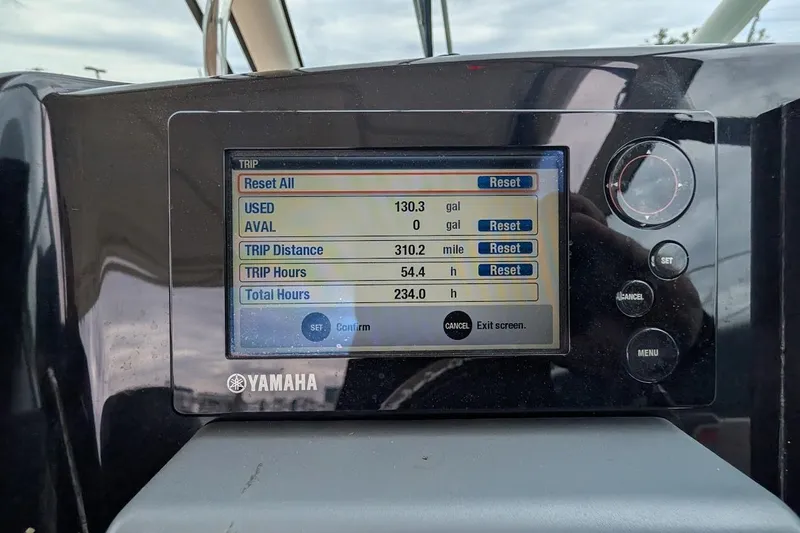 Slide: The Image of Yamaha display on 2011 Pursuit DC 265 Dual Console showing trip data and fuel usage. - 23