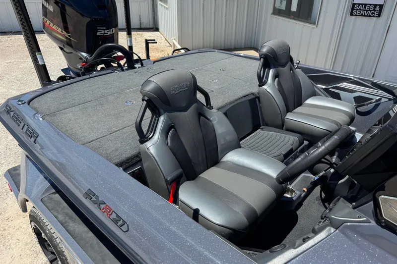 Slide: The Image of 2020 Skeeter FXR21 Apex boat interior with Yamaha 250 engine, showcasing seating and controls. - 2
