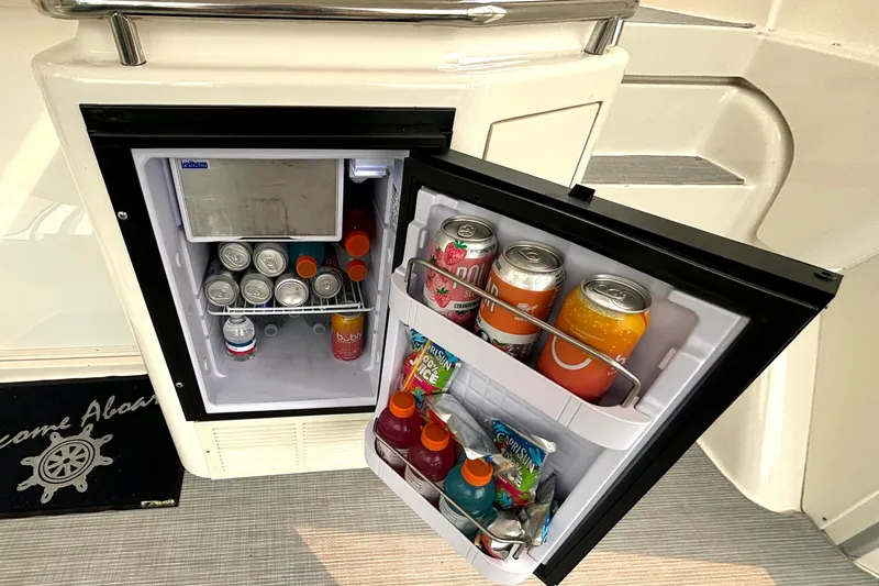 Slide: The Image of Mini fridge stocked with drinks on a 2000 Silverton 422 Motor Yacht. - 19