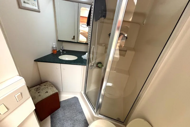 Slide: The Image of Bathroom interior of 2000 Silverton 422 Motor Yacht with shower and vanity. - 41