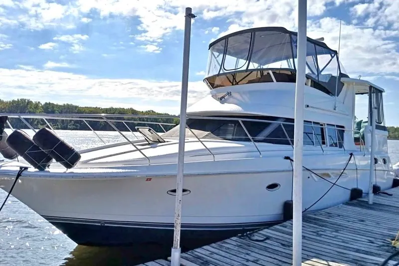 The Image of 2000 Silverton 422 Motor Yacht docked on a sunny day. - 1
