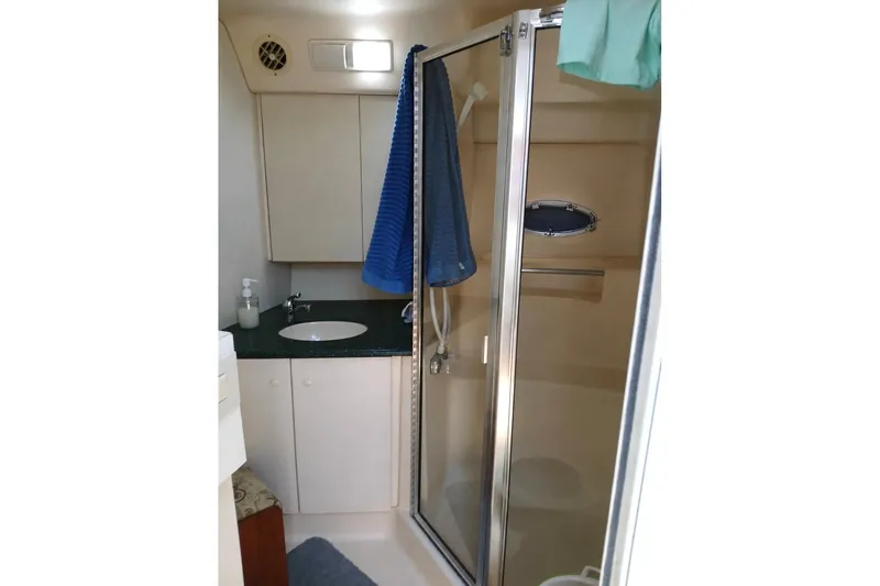Slide: The Image of Bathroom interior of 2000 Silverton 422 Motor Yacht with shower and sink. - 11