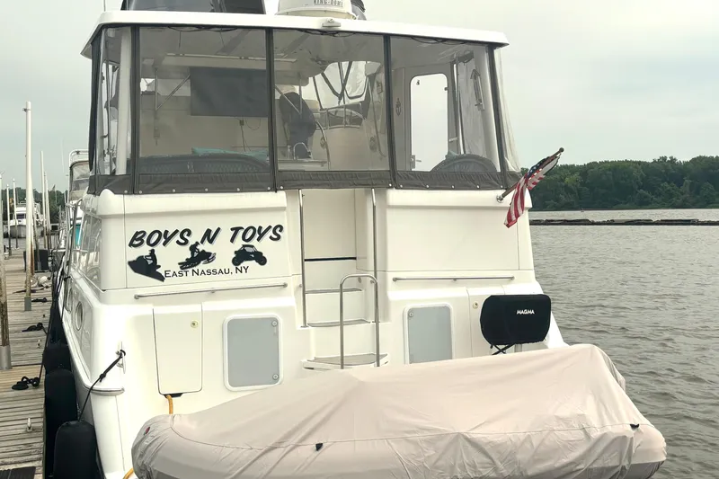 Slide: The Image of Silverton 422 Motor Yacht 2000 docked, named "Boys N Toys," East Nassau, NY. - 5