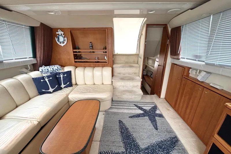 Slide: The Image of Luxurious interior of 2000 Silverton 422 Motor Yacht with nautical decor and plush seating. - 33