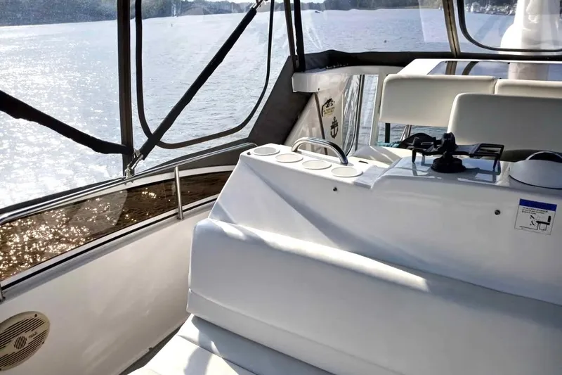 Slide: The Image of Interior view of 2000 Silverton 422 Motor Yacht with scenic water backdrop. - 4