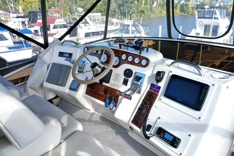 Slide: The Image of Cockpit of 2000 Silverton 422 Motor Yacht with steering wheel and navigation instruments. - 5