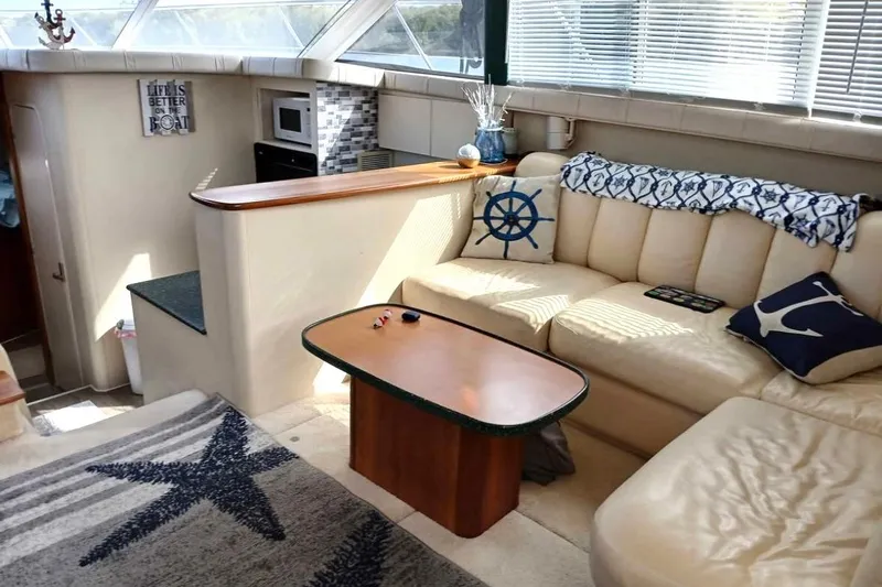 Slide: The Image of Luxurious interior of 2000 Silverton 422 Motor Yacht with nautical decor and comfortable seating. - 6