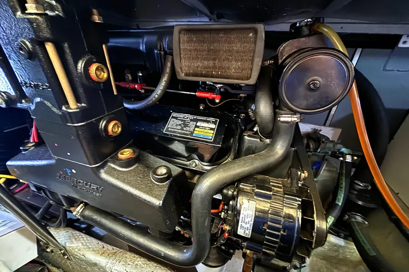 Slide: The Image of Engine compartment of a 2000 Silverton 422 Motor Yacht, featuring Mercury components. - 55
