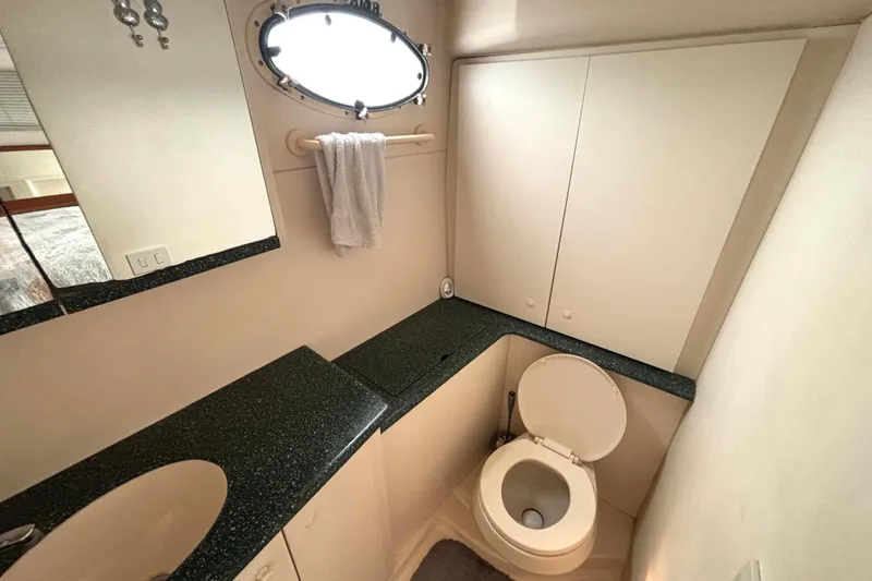 Slide: The Image of Bathroom interior of 2000 Silverton 422 Motor Yacht with modern fixtures and cabinetry. - 45