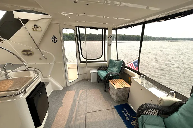 Slide: The Image of Interior of a 2000 Silverton 422 Motor Yacht with seating and water view. - 17