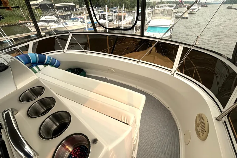 Slide: The Image of Interior view of 2000 Silverton 422 Motor Yacht with seating and cup holders. - 22
