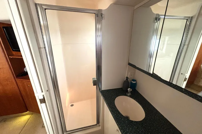 Slide: The Image of Bathroom interior of 2000 Silverton 422 Motor Yacht with shower and sink. - 46