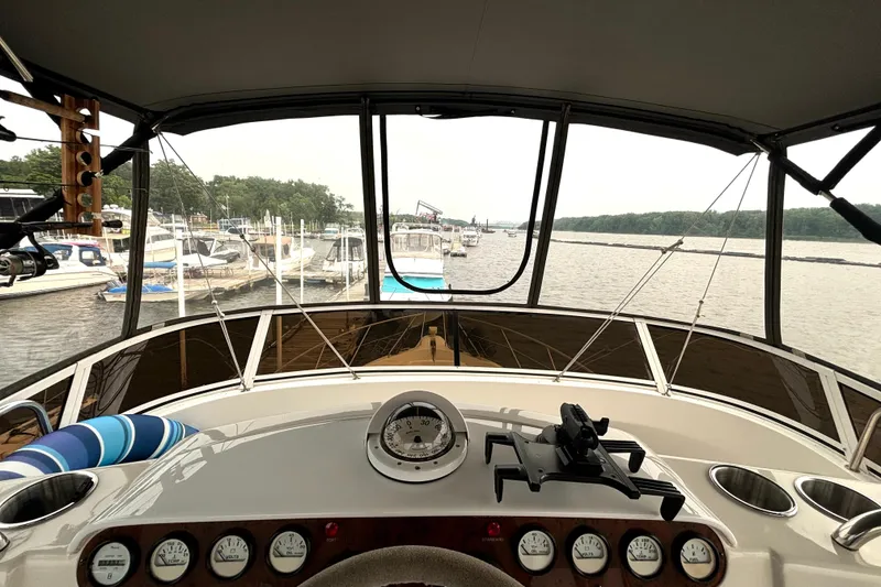 Slide: The Image of View from the helm of a 2000 Silverton 422 Motor Yacht at a marina. - 27