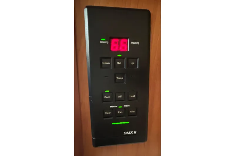 Slide: The Image of Control panel of a 2000 Silverton 422 Motor Yacht, displaying temperature settings. - 50