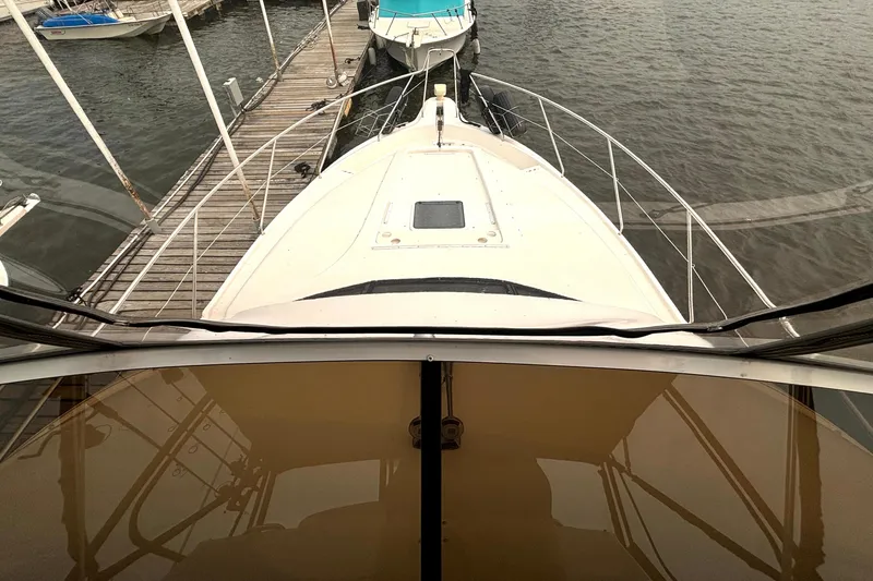 Slide: The Image of 2000 Silverton 422 Motor Yacht docked at marina, viewed from helm. - 29