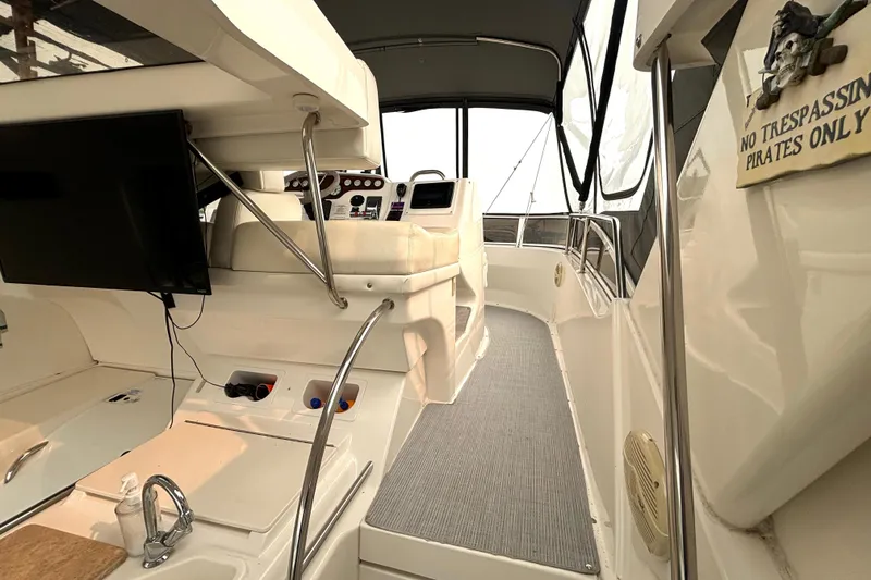 Slide: The Image of Interior view of 2000 Silverton 422 Motor Yacht with helm and seating area. - 20