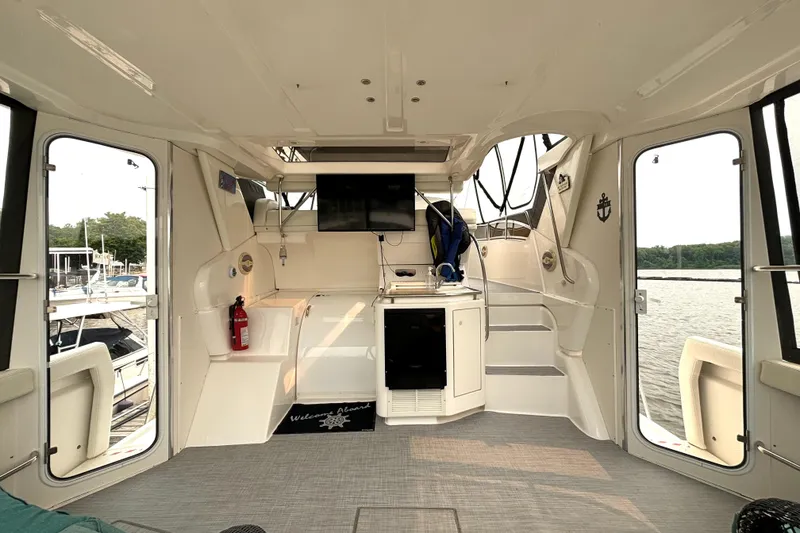 Slide: The Image of Interior of a 2000 Silverton 422 Motor Yacht with modern amenities and scenic water view. - 15