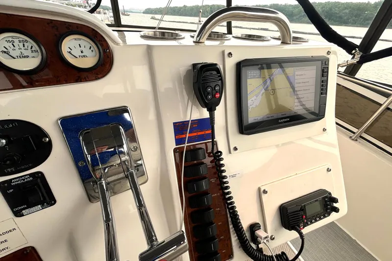 Slide: The Image of Control panel of a 2000 Silverton 422 Motor Yacht with navigation equipment. - 24