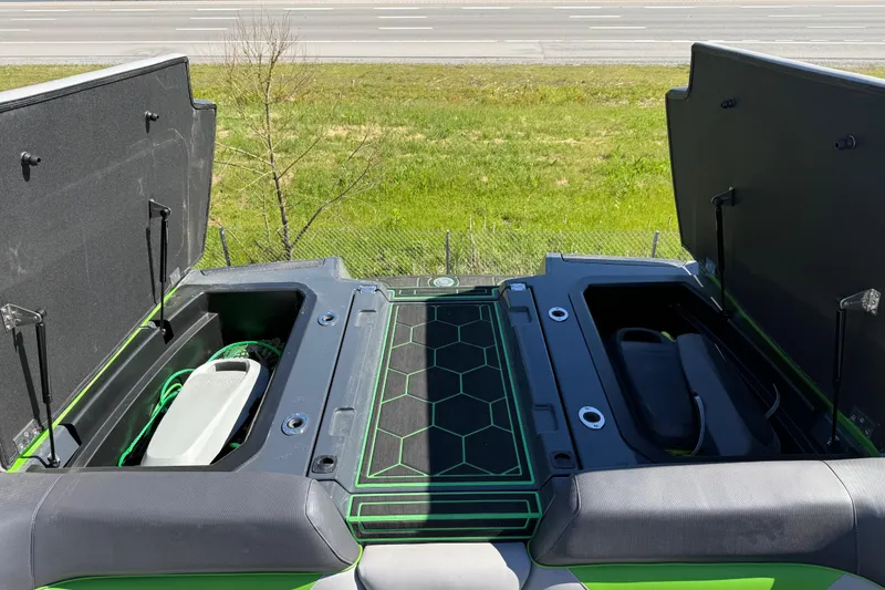 Slide: The Image of 2022 Moomba Makai boat storage compartments open, showcasing interior design and features. - 14
