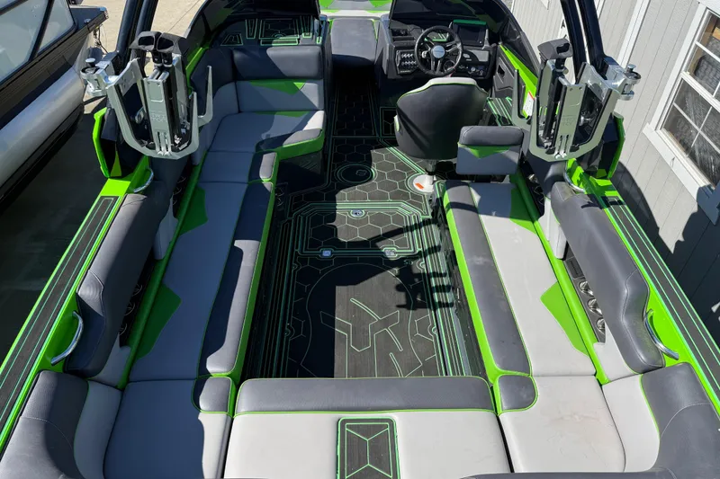Slide: The Image of 2022 Moomba Makai boat interior with green and gray seating, modern design. - 18