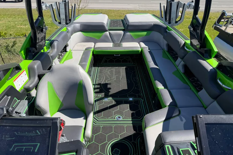 Slide: The Image of 2022 Moomba Makai boat interior with green and gray seating, modern design. - 4