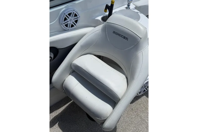 Slide: The Image of White leather seat on 2013 Rinker 246 Captiva Cuddy boat interior. - 14